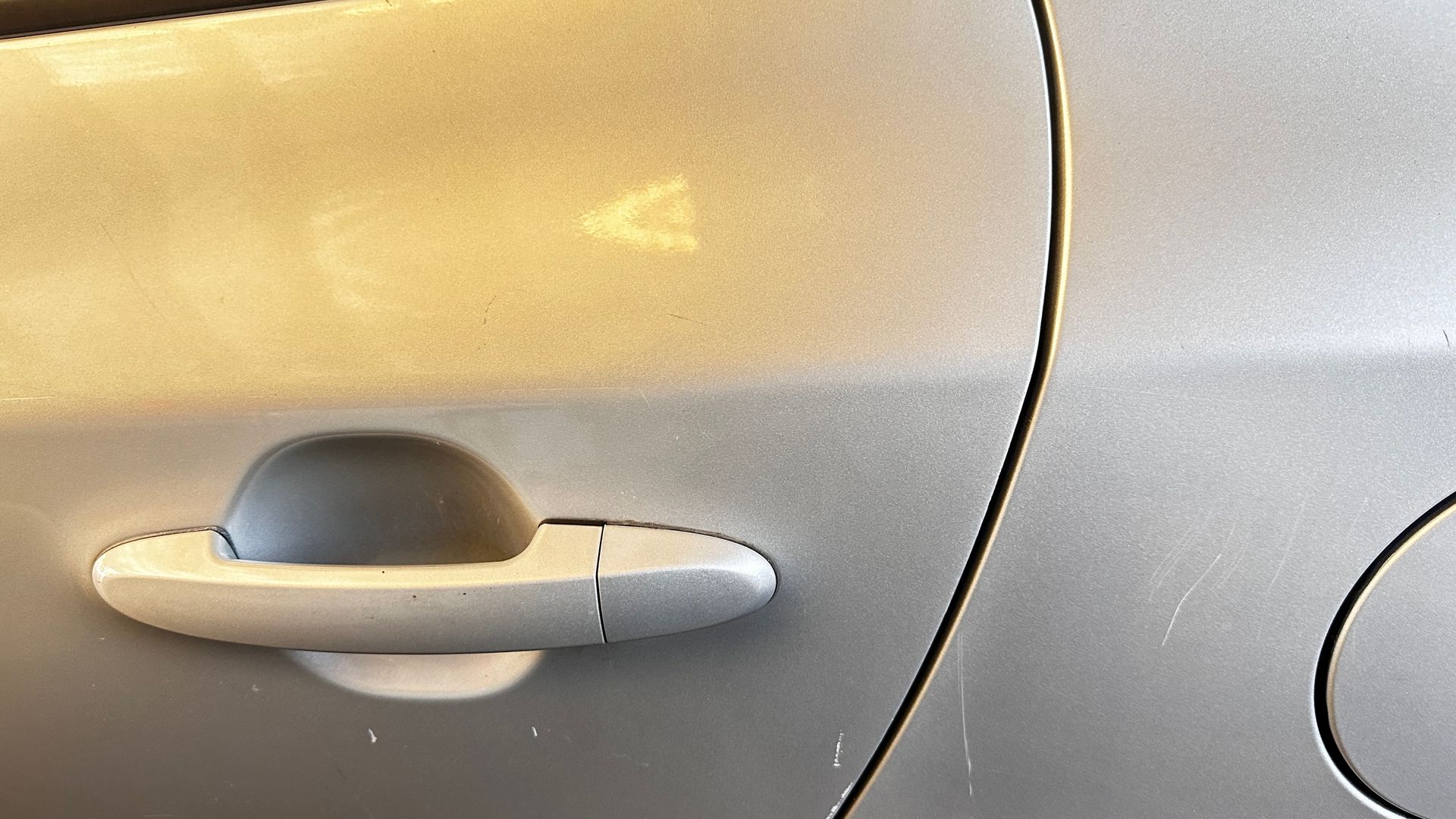 White Car Door With A Fixed Dent — Dent Repair Specialist in Kunda Park, QLD