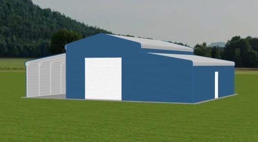 Blue metal barn with white door and attached open-air shelter on green grass field, mountain backdrop.