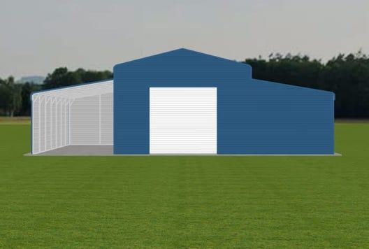 Blue and white metal building with open carport on green grass against a treeline.