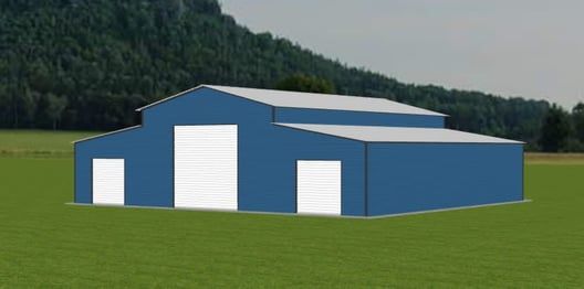 Blue barn with white doors on a green field with a tree-covered mountain in the background.