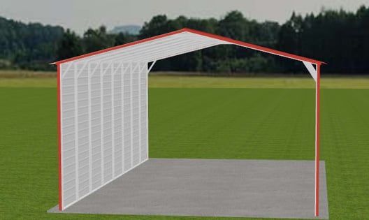 Red-framed carport with white siding and roof, set on a concrete pad, in a field with trees in the background.