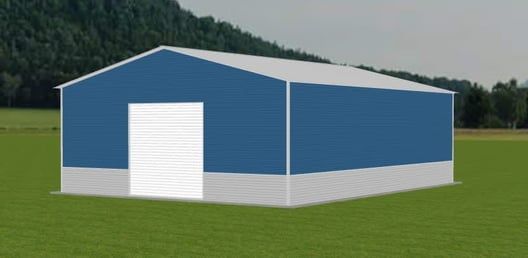 Blue metal building with white door, on a green field with trees in the background.