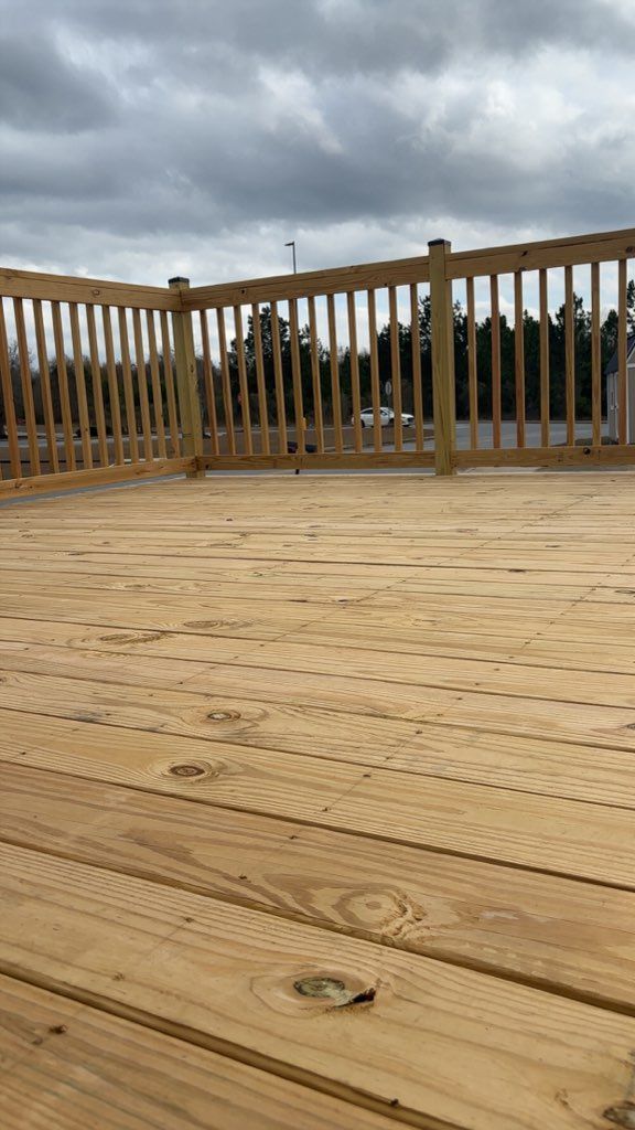Metal frame of a corrugated metal building against a blue sky.