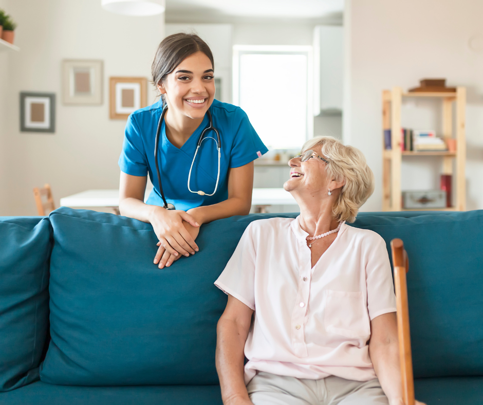An elderly man with a cane is sitting in a chair next to a nurse.