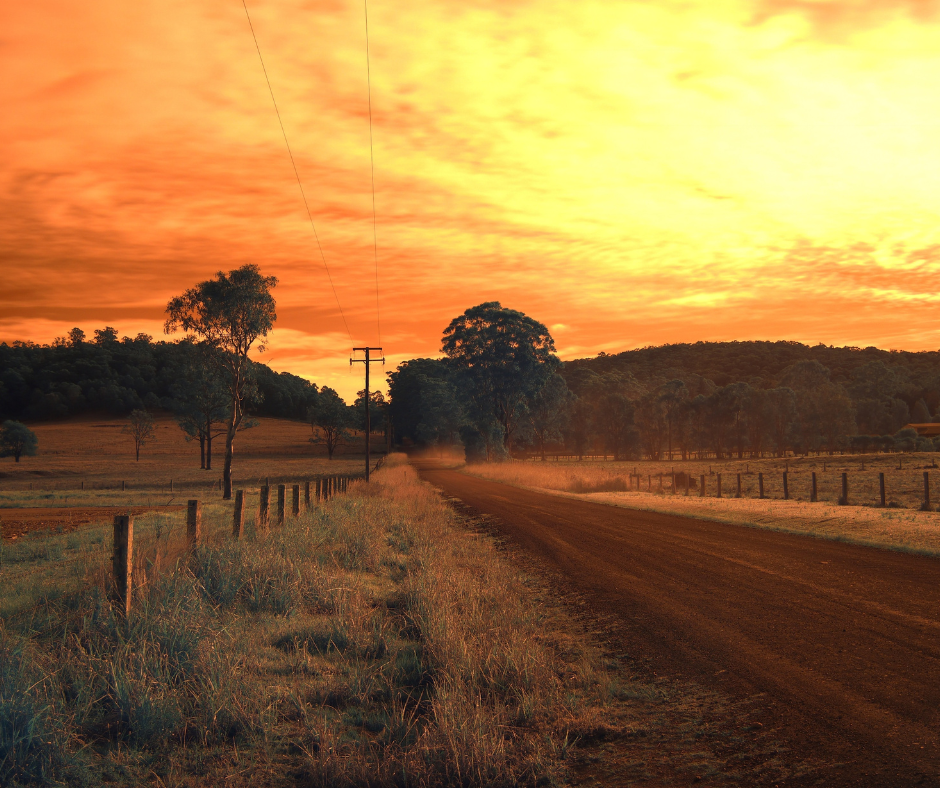 An old wooden boatshed accessed via a wooden jetty