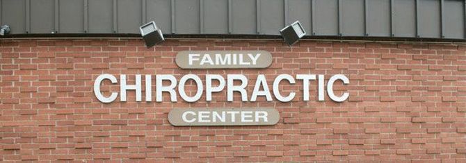 A brick building with a sign that says family chiropractic center