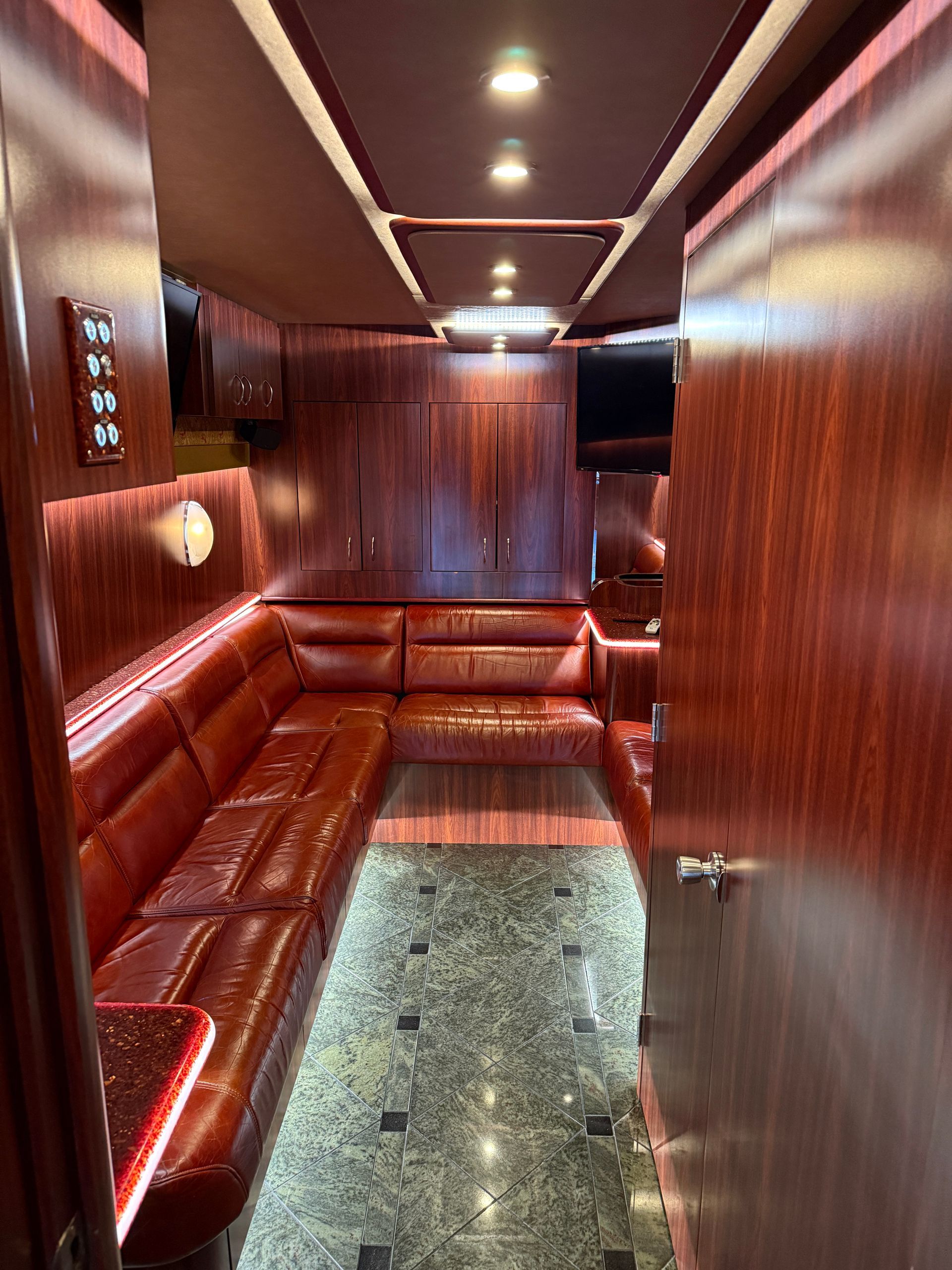 Rear lounge with plush seating and entertainment features for crew relaxation
