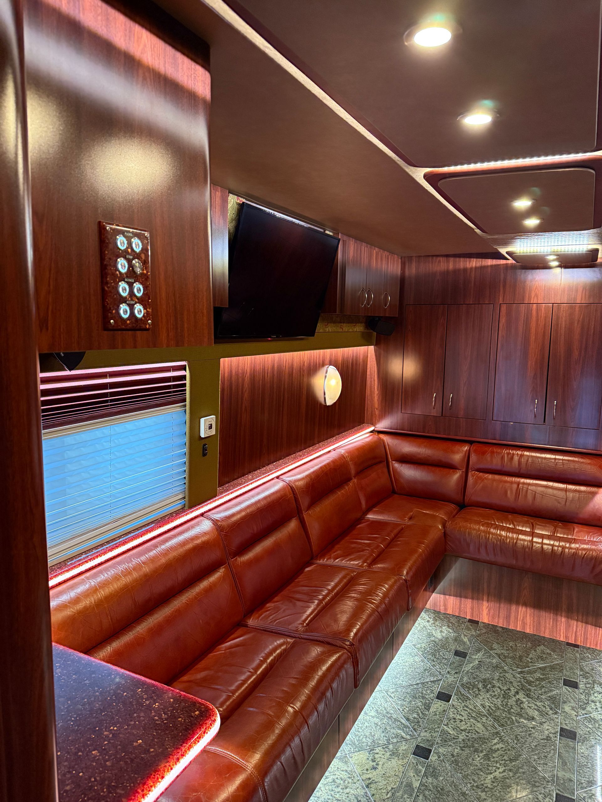 Coach 13 front slide-out expanded to reveal luxurious open living area