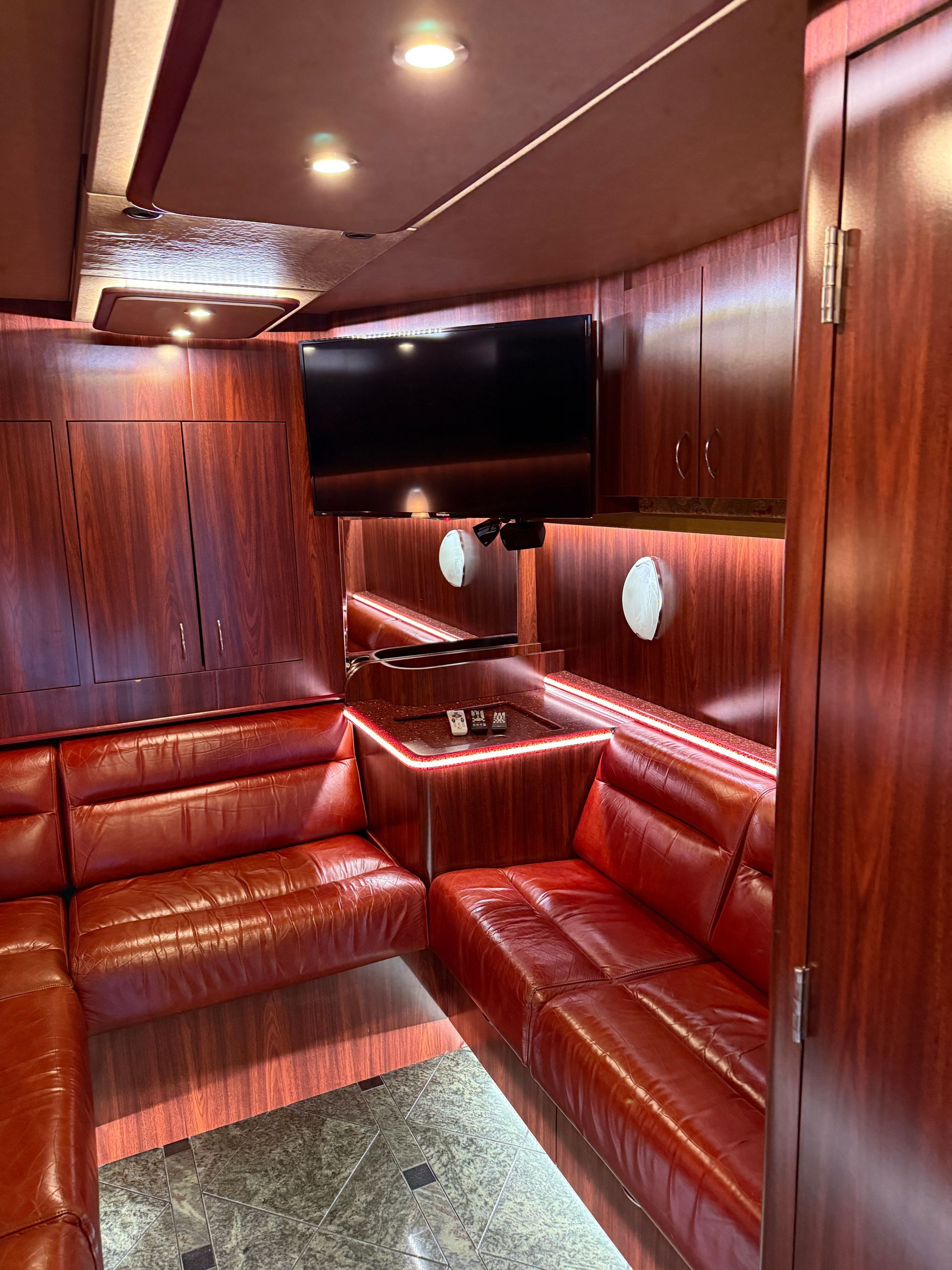 Spacious interior lounge of Coach 13 featuring premium seating and ambient lighting