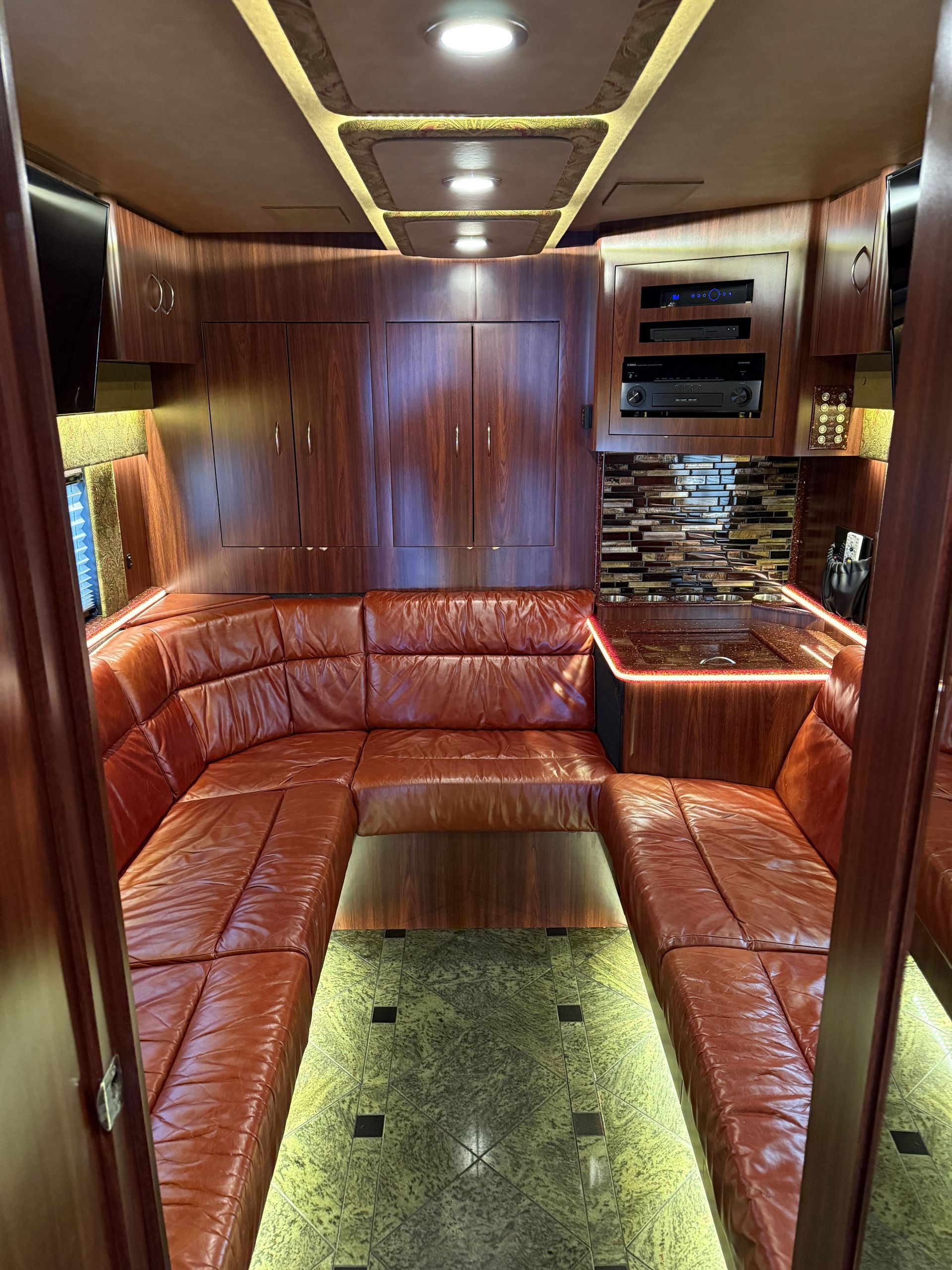 Rear lounge with plush seating and entertainment features for crew relaxation