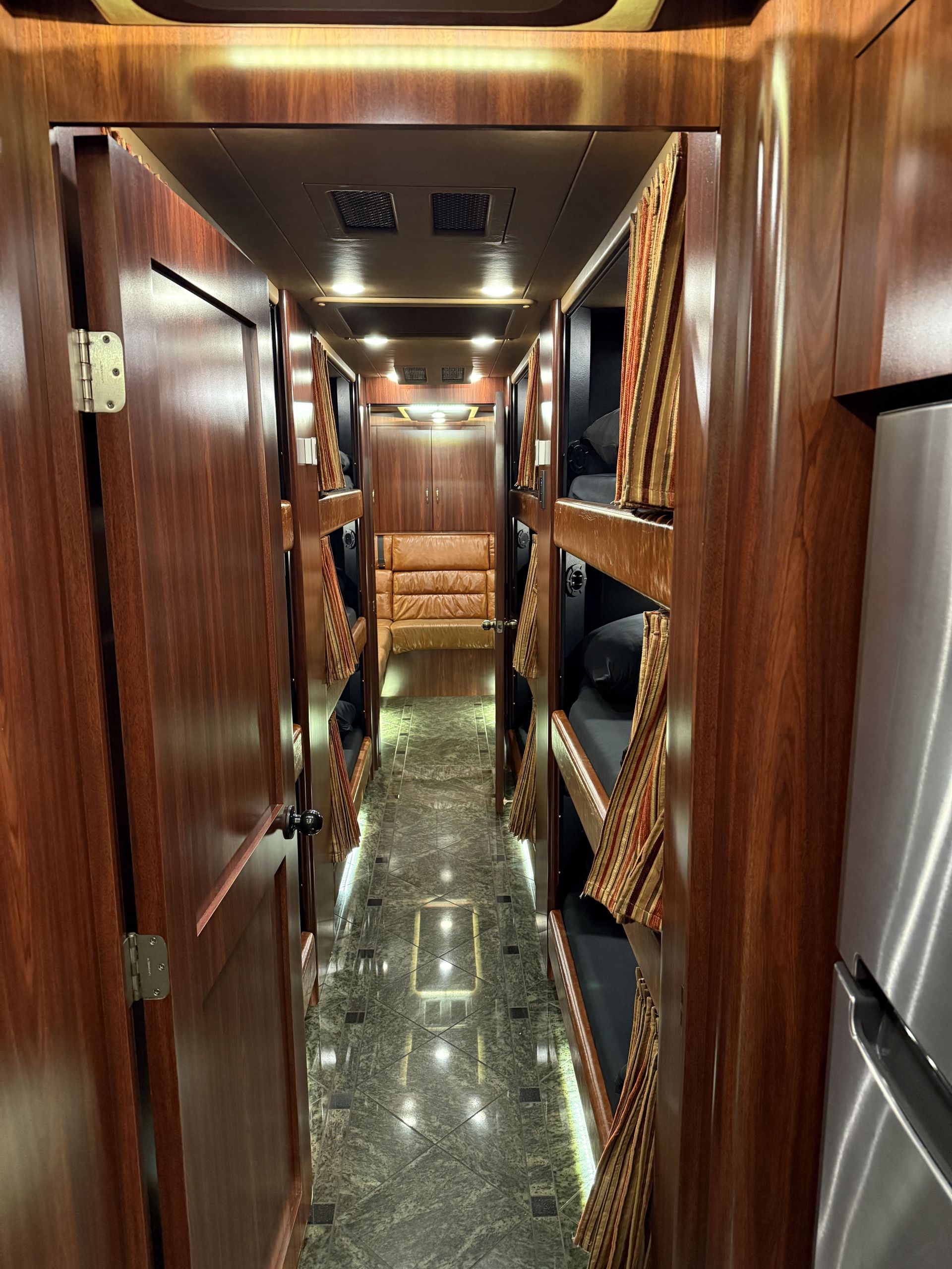 Coach 17 front slide-out expanded to reveal luxurious open living area