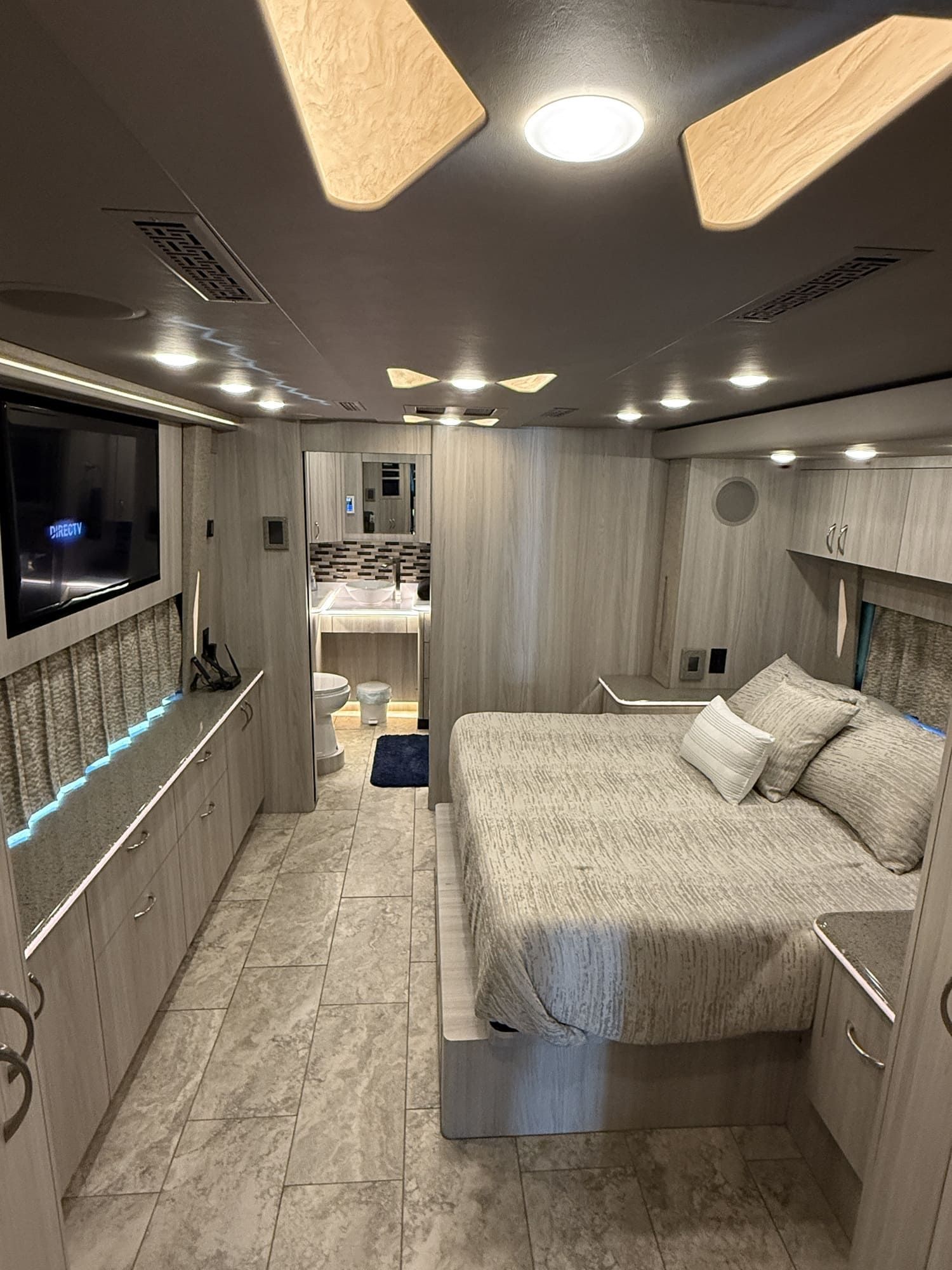 Entertainment center with flat-screen TV, DVD player, stereo, and satellite system