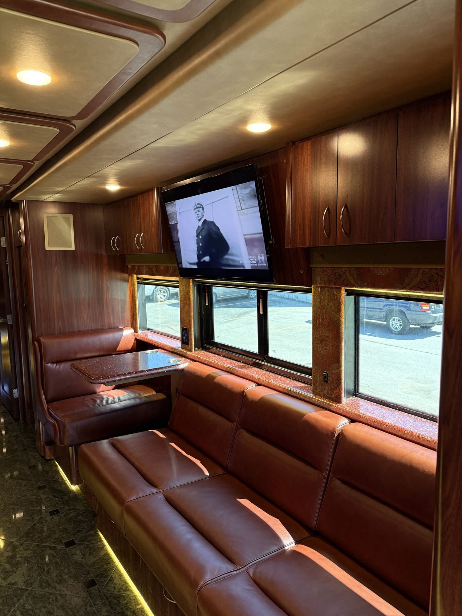 Spacious interior lounge of Coach 16 featuring premium seating and ambient lighting