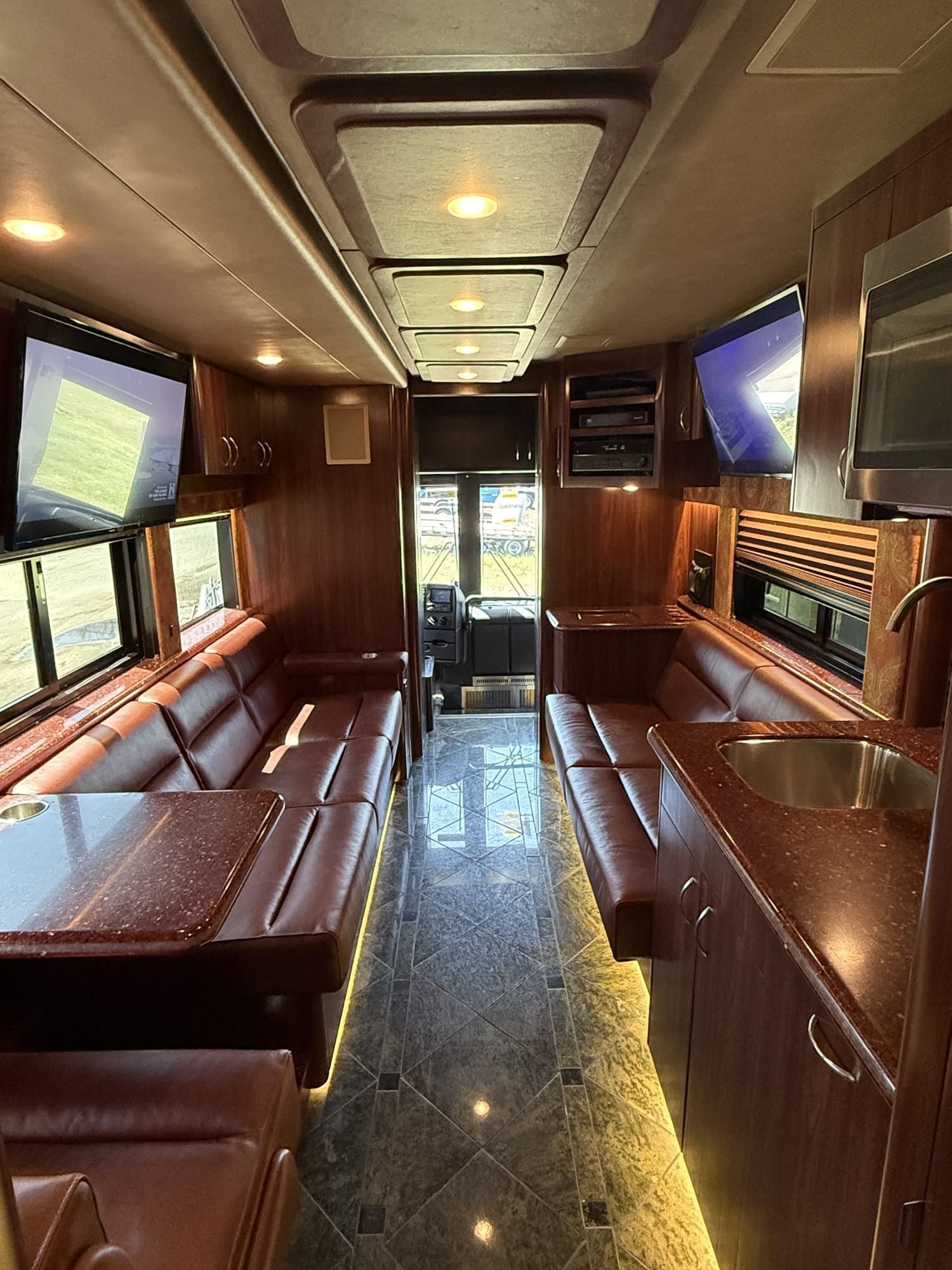 Coach 16 front slide-out expanded to reveal luxurious open living area