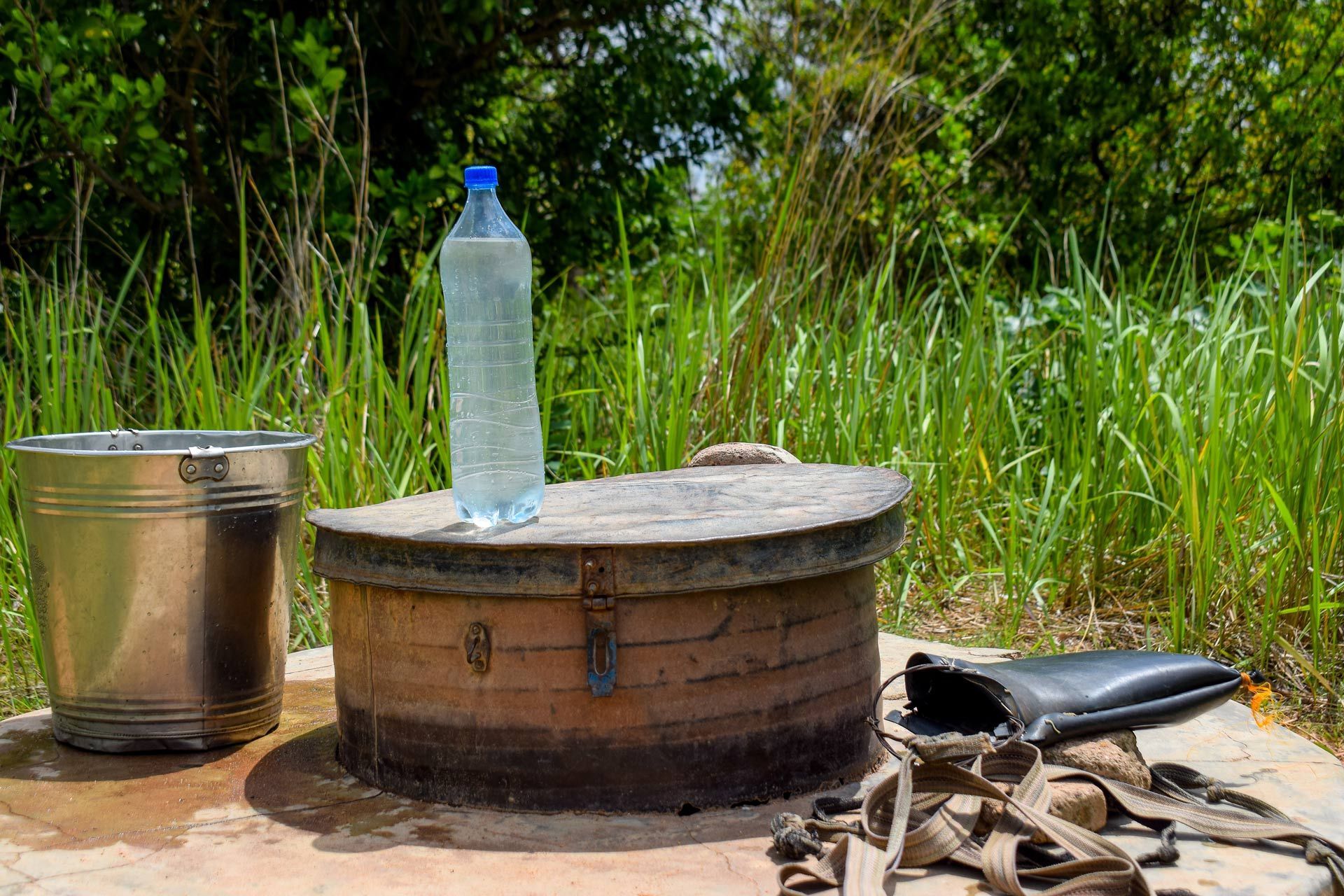 Water bottle on top of a well