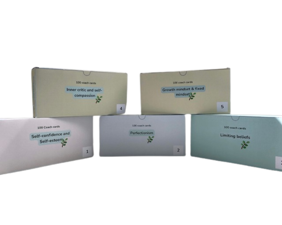 A group of boxes with coach cards stacked on top of each other on a white background.