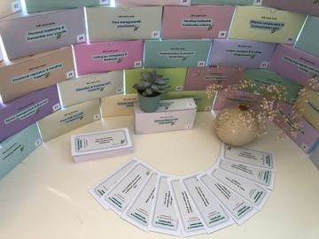 A bunch of coach cards are stacked on top of each other on a table