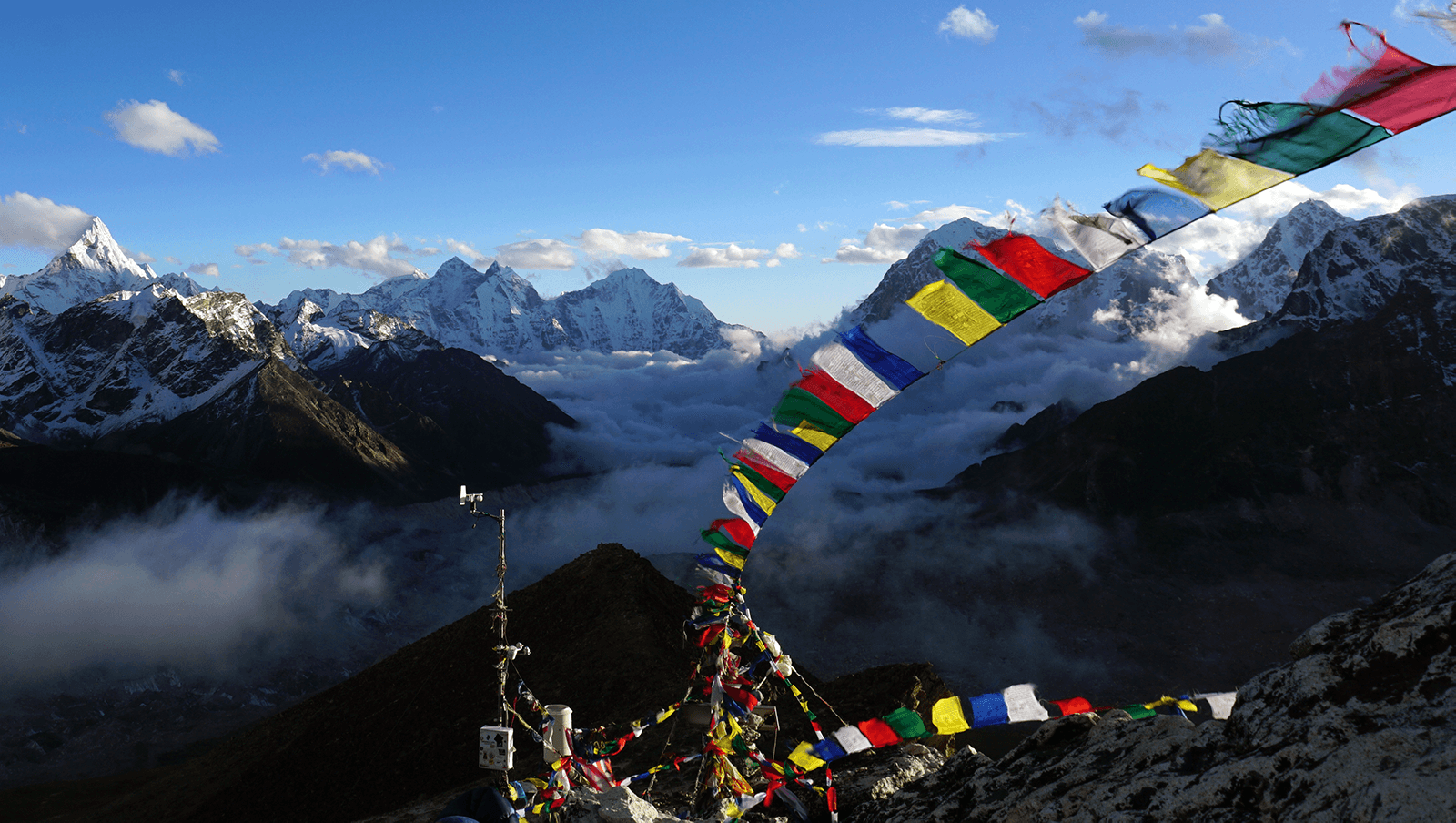 Prayer flags over himalayan mountains in Lobuce on Everest Base Camp Trek
