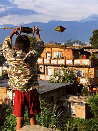 Child Flying Kite in Kathmandu during Dashain