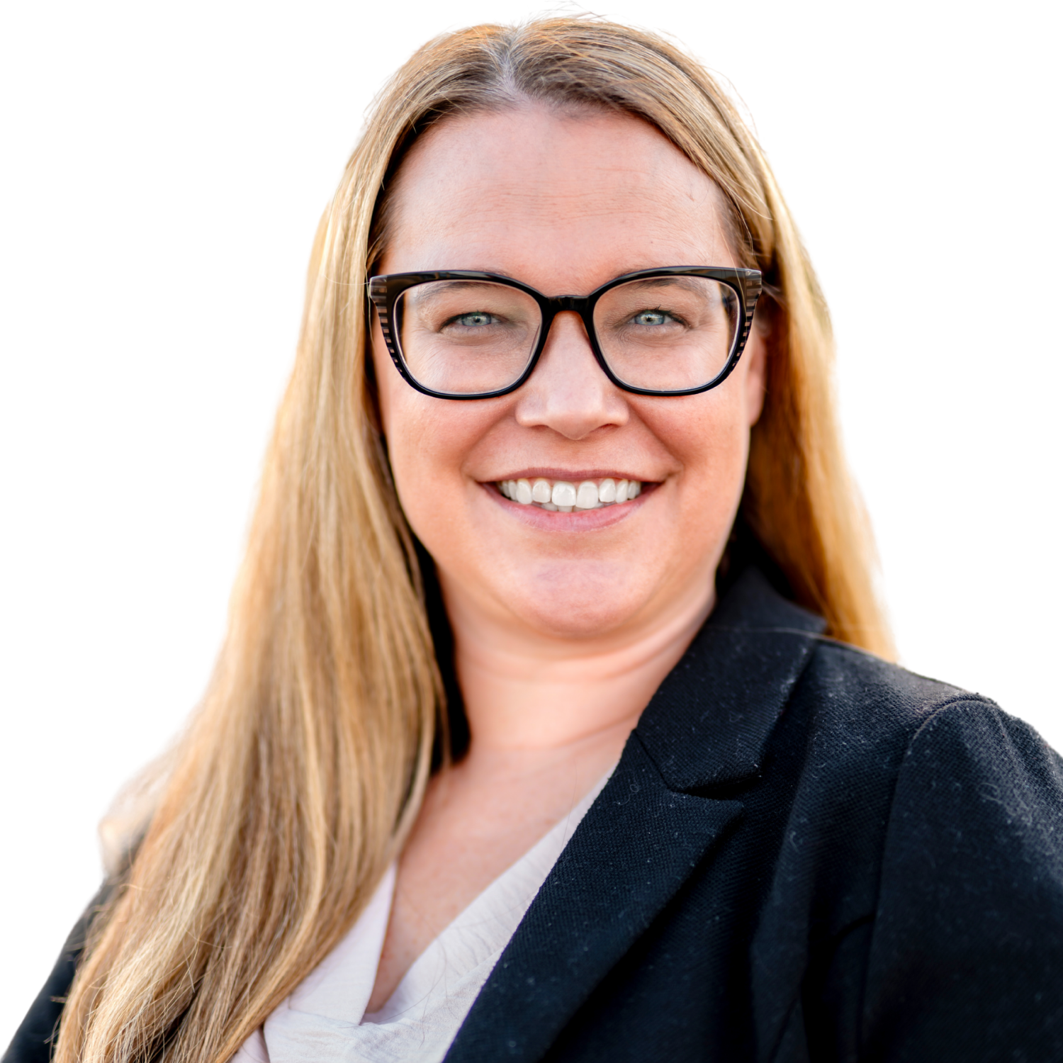 A woman in a suit smiling