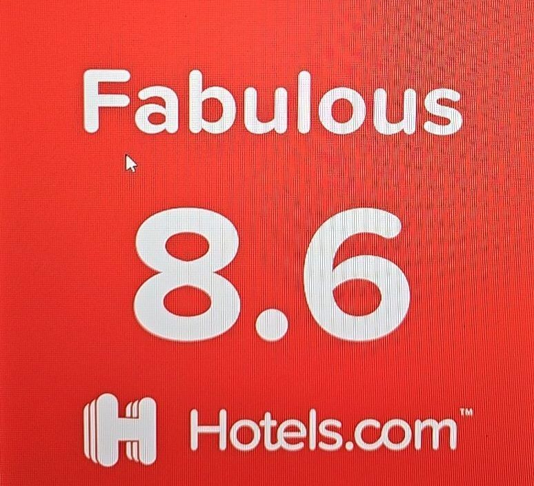 The logo for the jefferson inn has a mountain and animals on it.