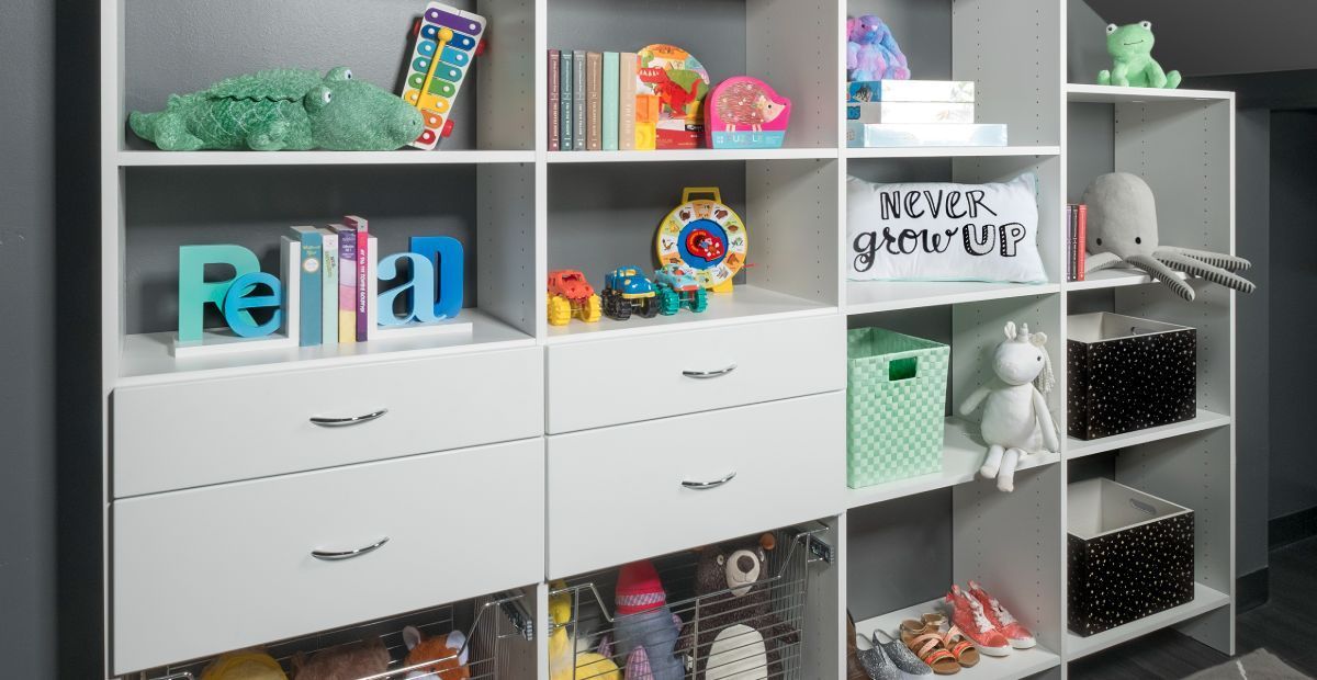 A room with a lot of shelves and drawers filled with toys.