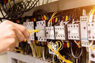 Electrical Contractor — Electrician Measurements With Multimeter Tester System Ready in Manheim, PA