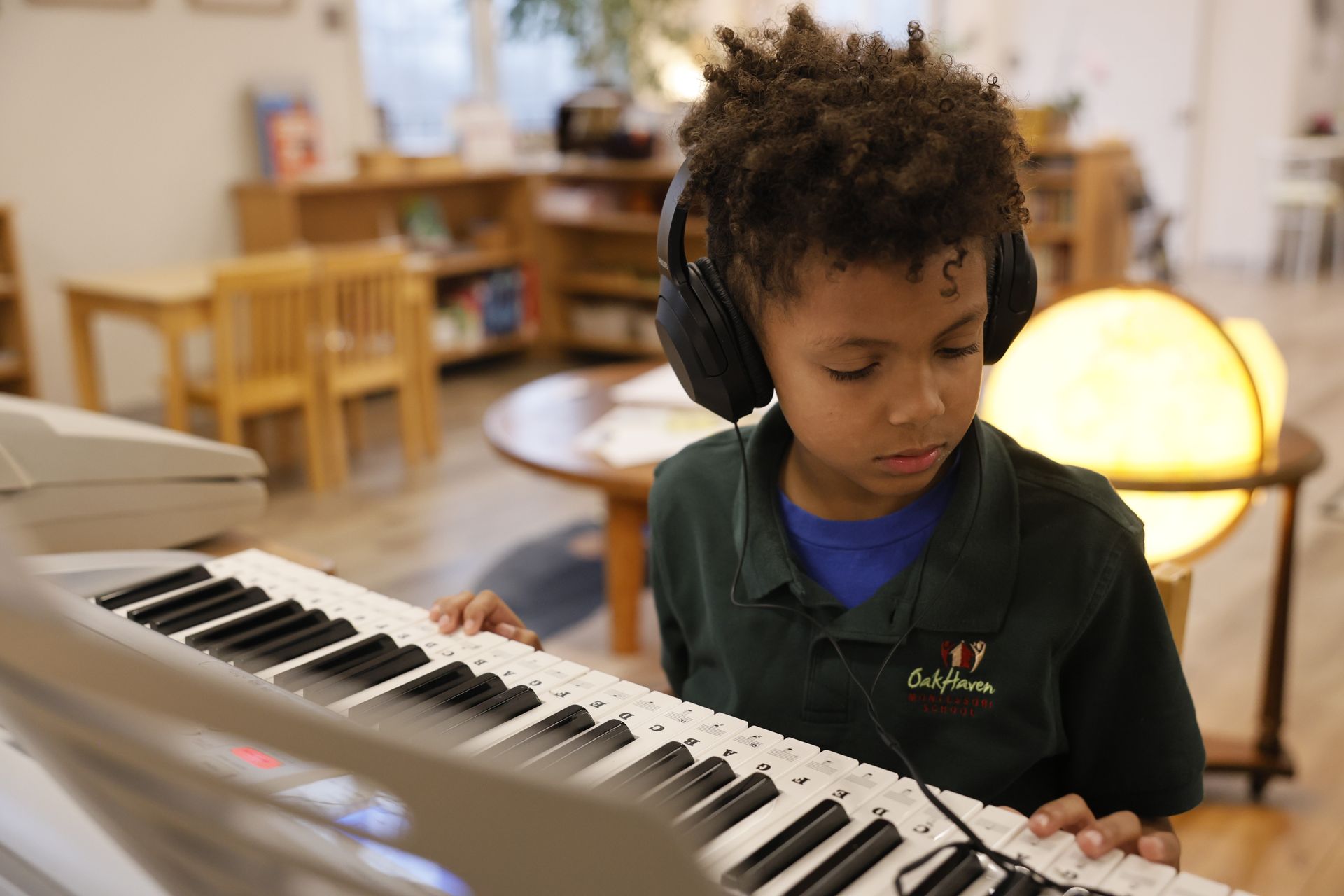 Montessori child playing piano