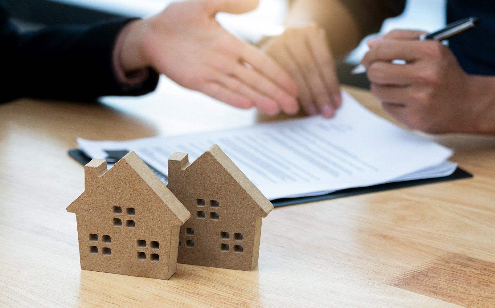 Customer Signing a Real Estate Contract – Honolulu, HI – Hawaiian Properties
