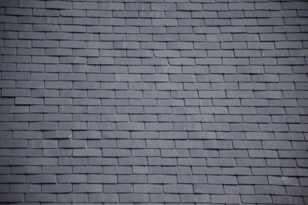 A close up of a roof made of slate tiles.