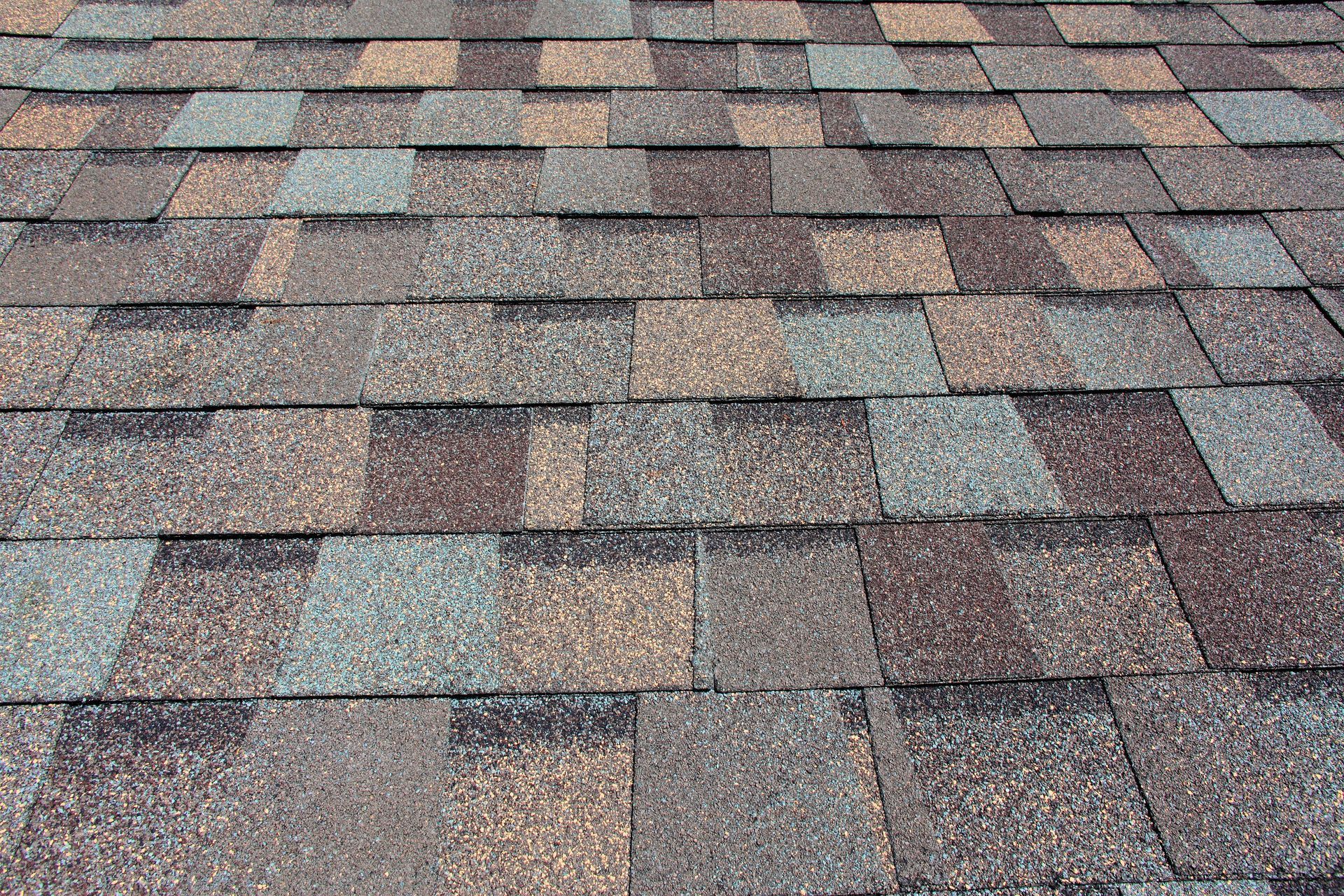 a close up of a roof with a lot of shingles on it .