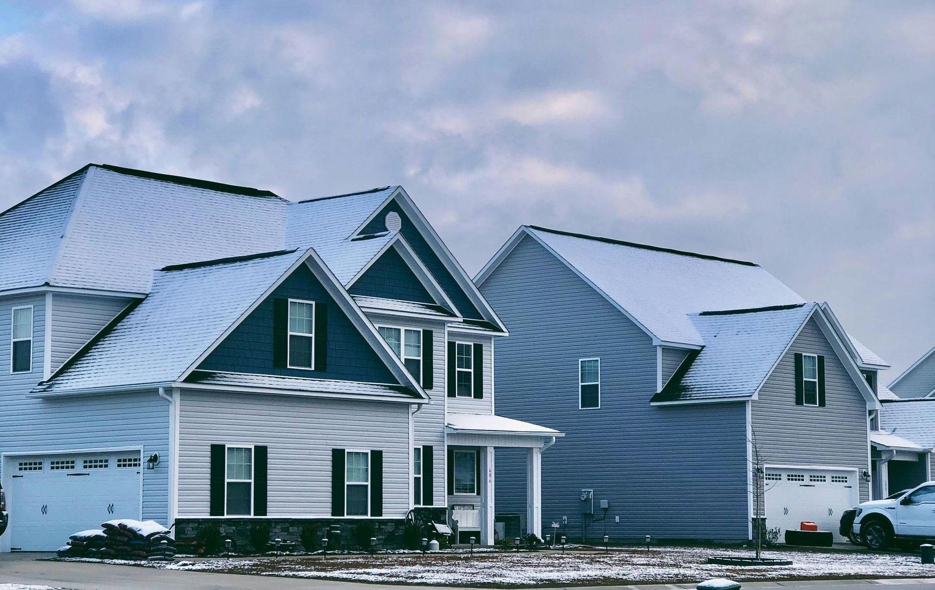 A snow-covered roof for winter damage, highlighting the importance of  winter roof maintenance.