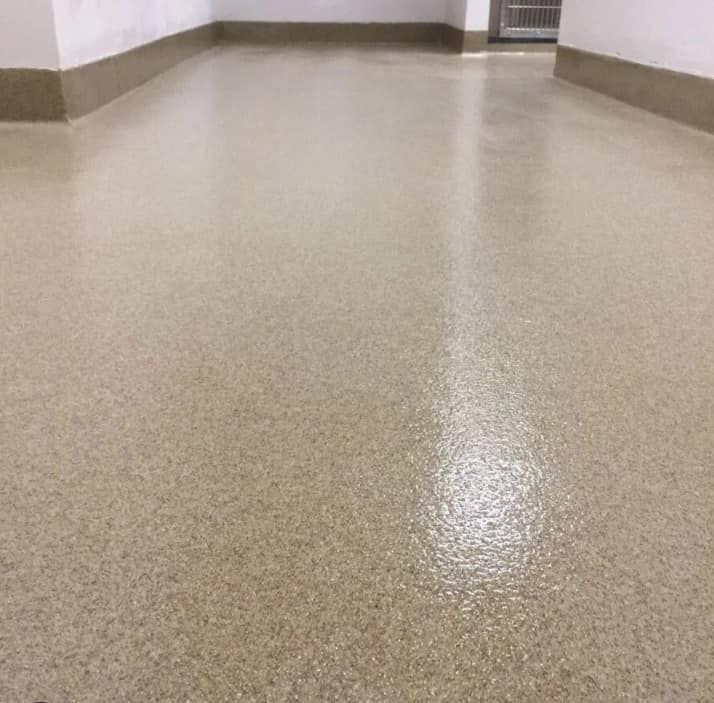 A close up of a beige floor in a room.