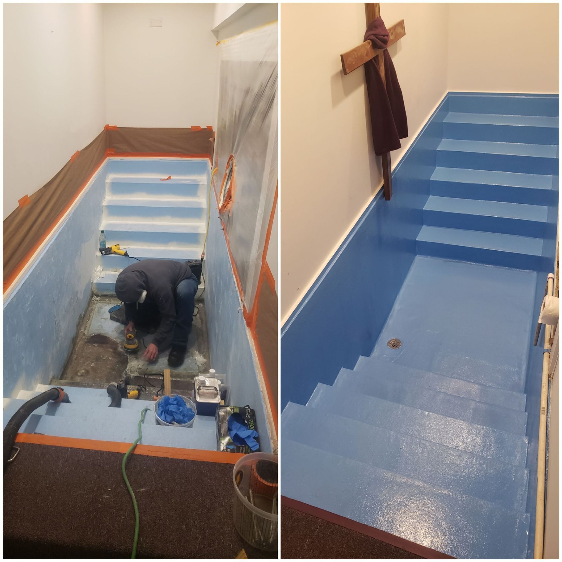 A man is working on stairs in a room with a cross on the wall