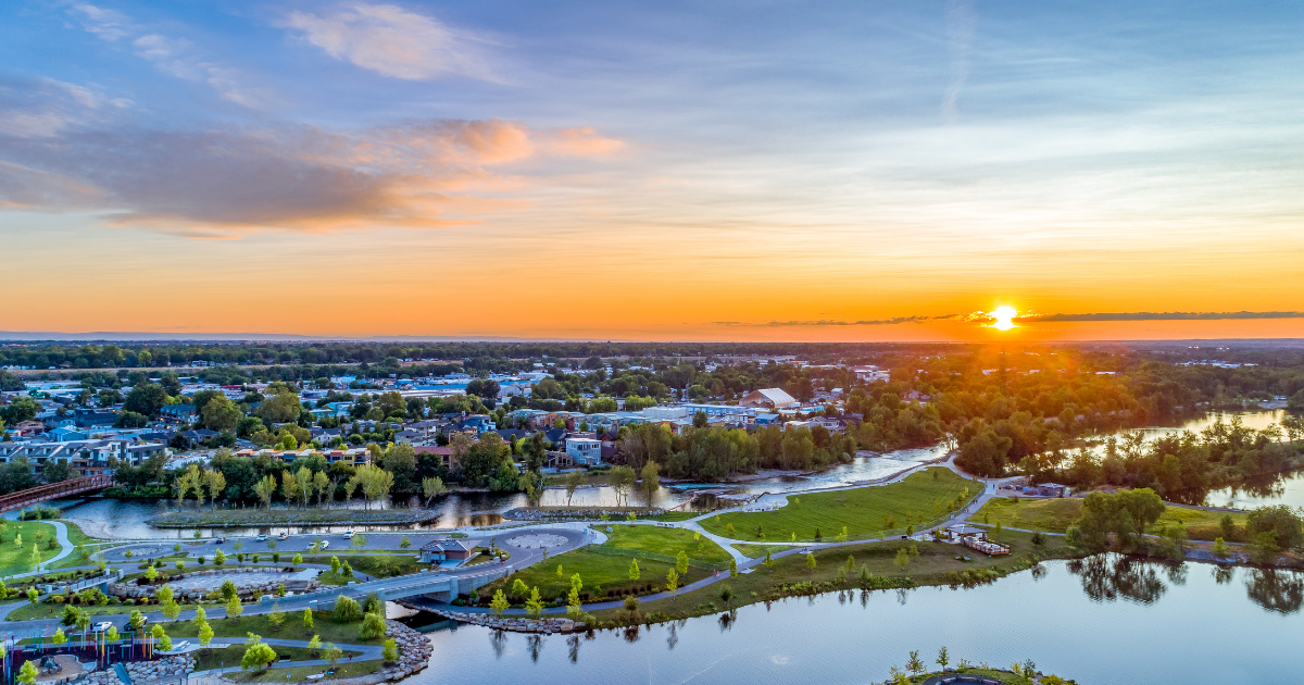 A large house with a large swimming pool in front of it.