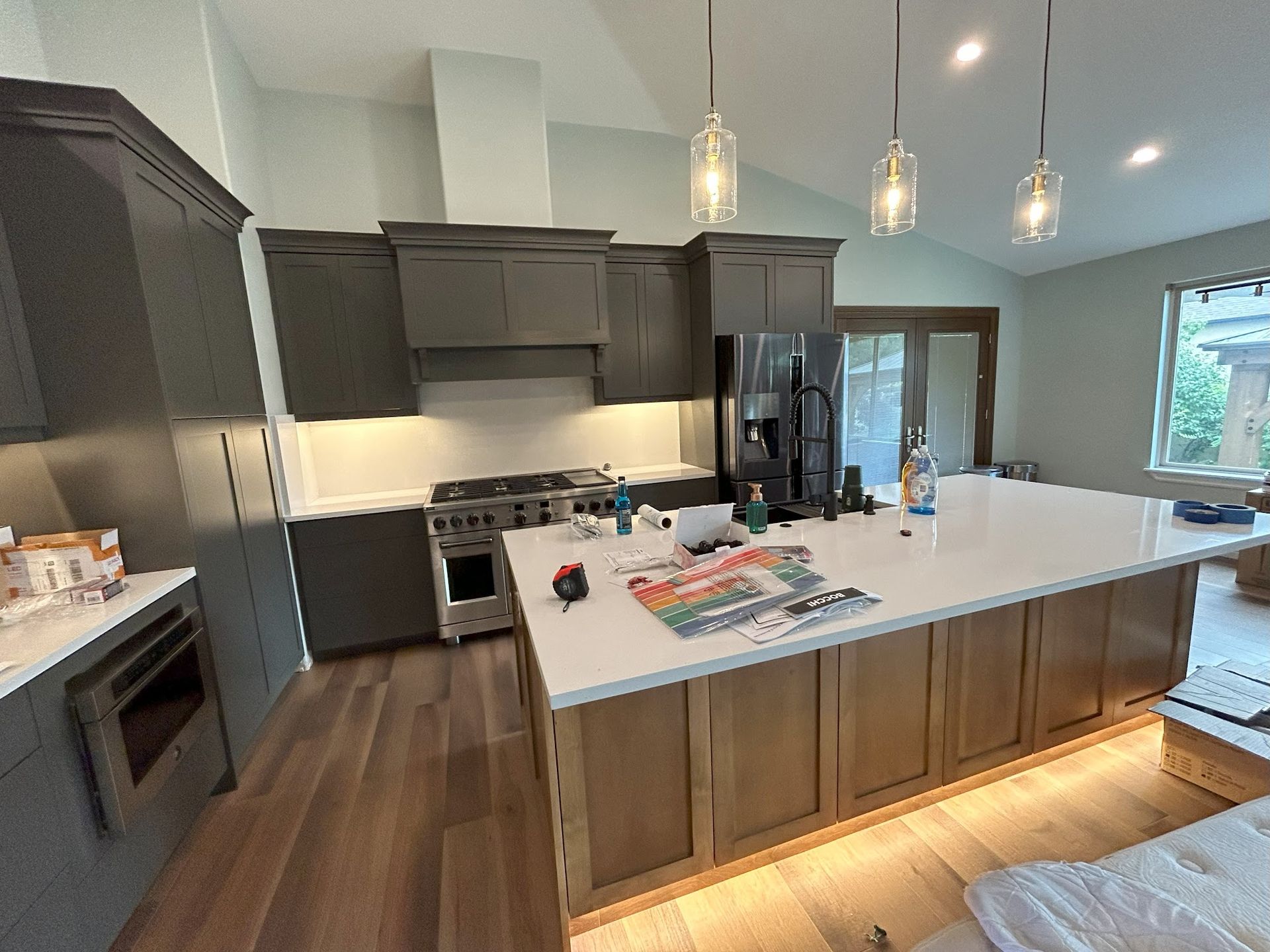 A kitchen with a large island in the middle of the room.