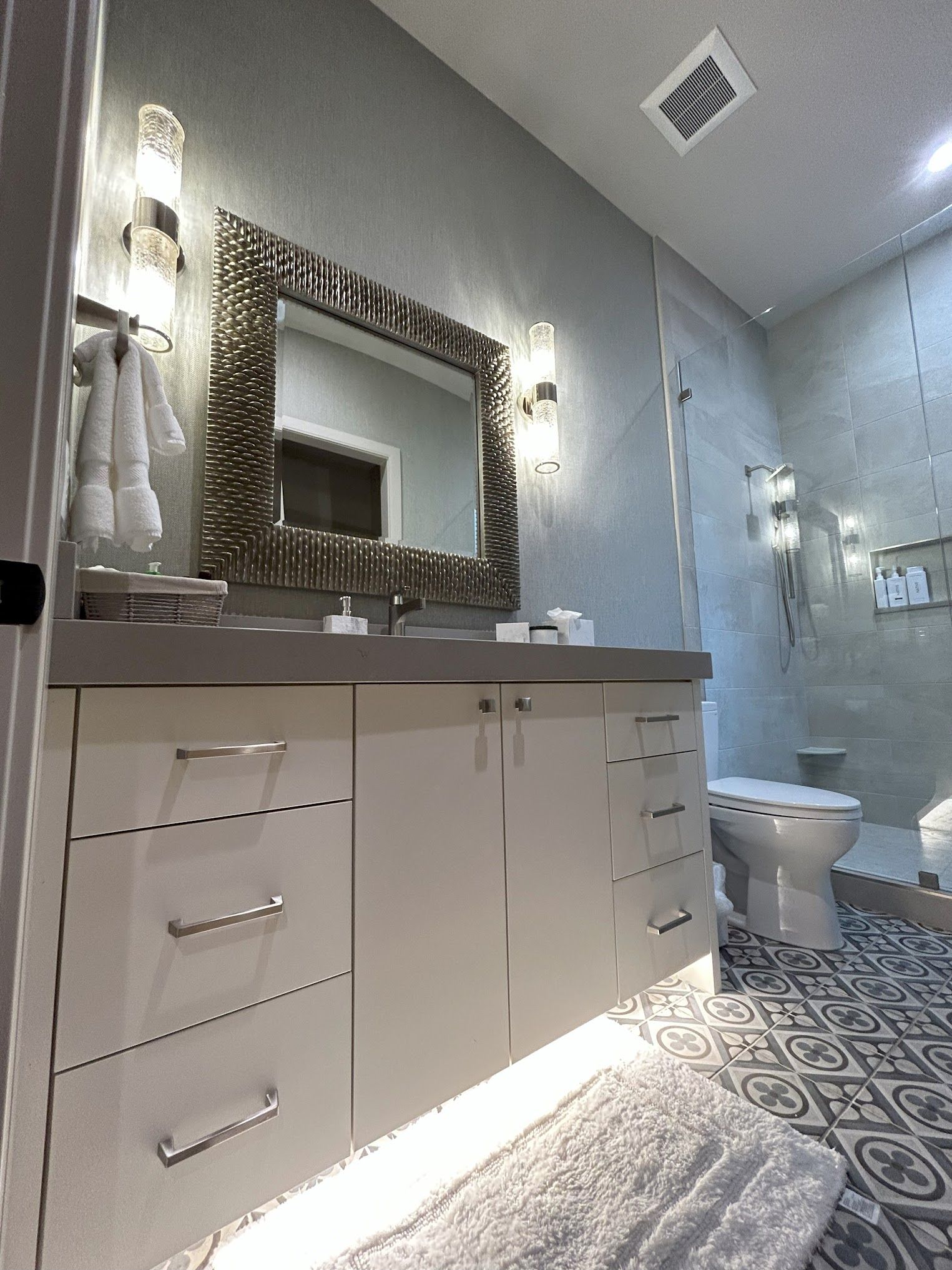 A bathroom with a sink , toilet , and mirror.