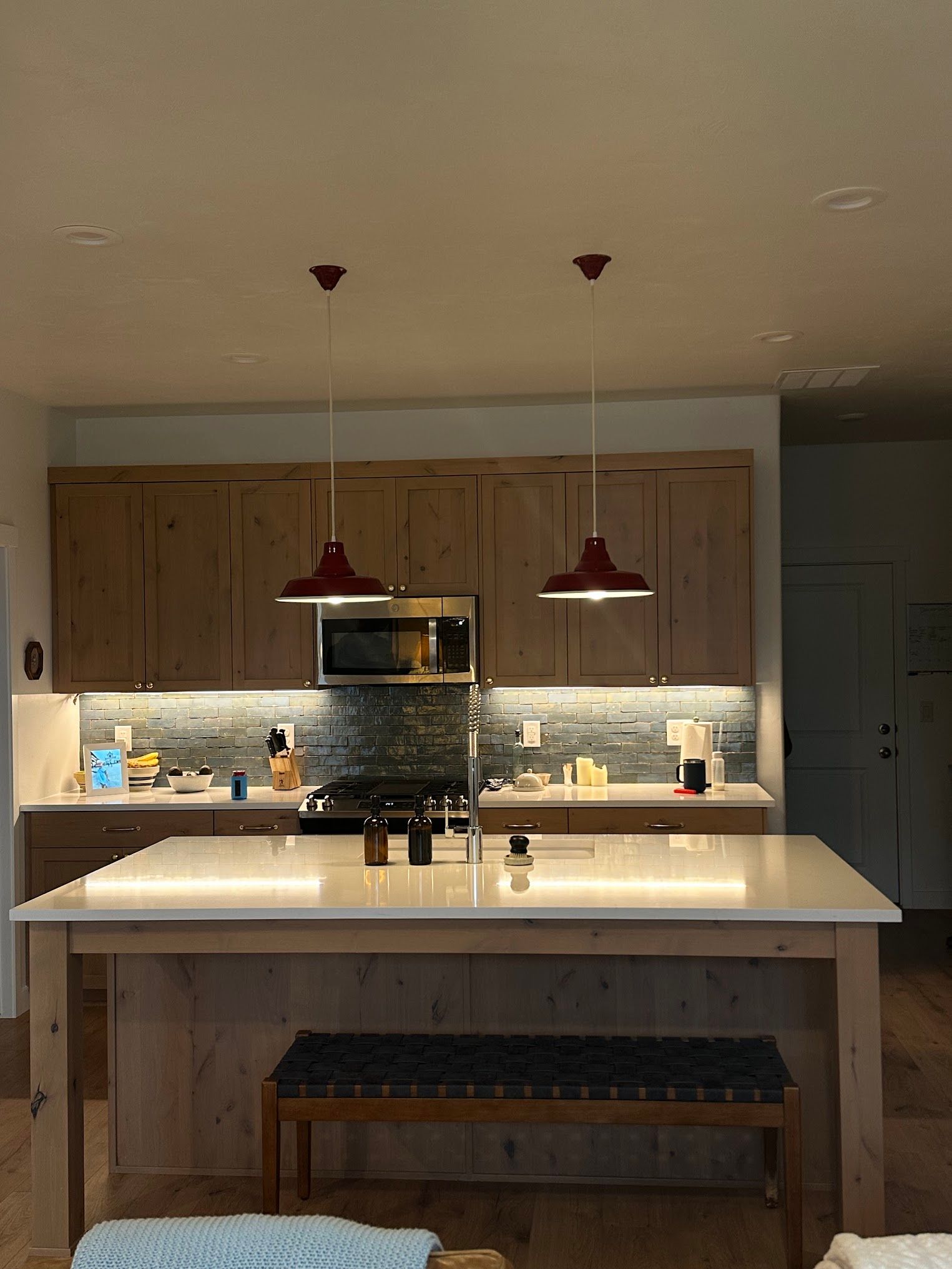 A kitchen with a large island and a bench