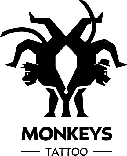 Dos figuras de monos reflejadas, una con pelo puntiagudo y otra con sombrero, unidas por el torso.