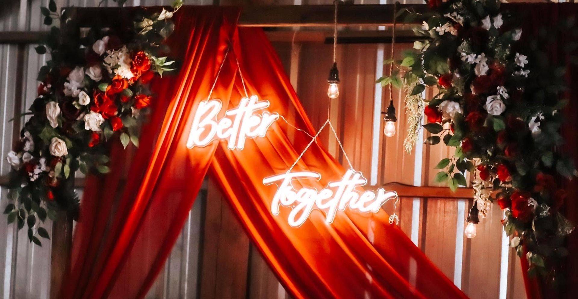 A sign that says better together hangs from a red curtain – Pasco, WA - Decoraciones Garcia