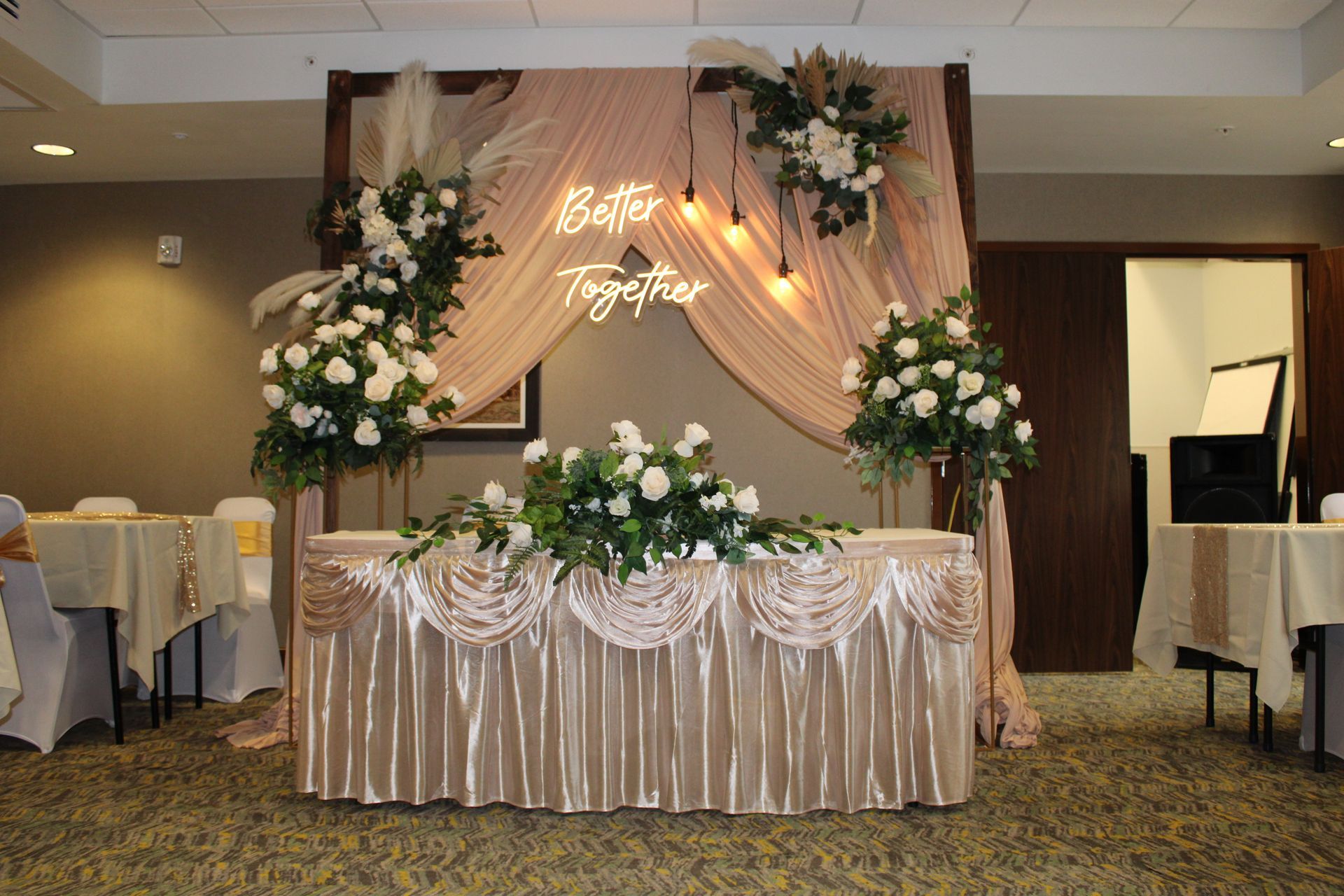 A table with flowers and a sign that says better together – Pasco, WA - Decoraciones Garcia