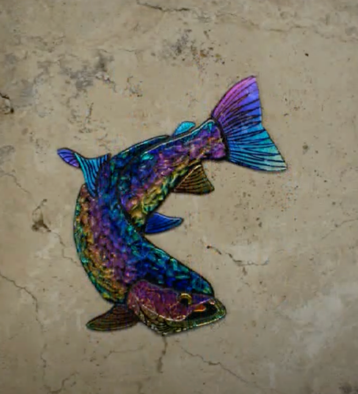 dichroic catfish on tan stone 