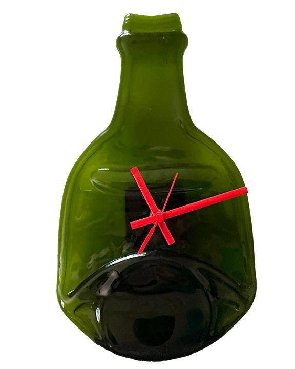 a green flattened glass bottle with a red clock hands on it