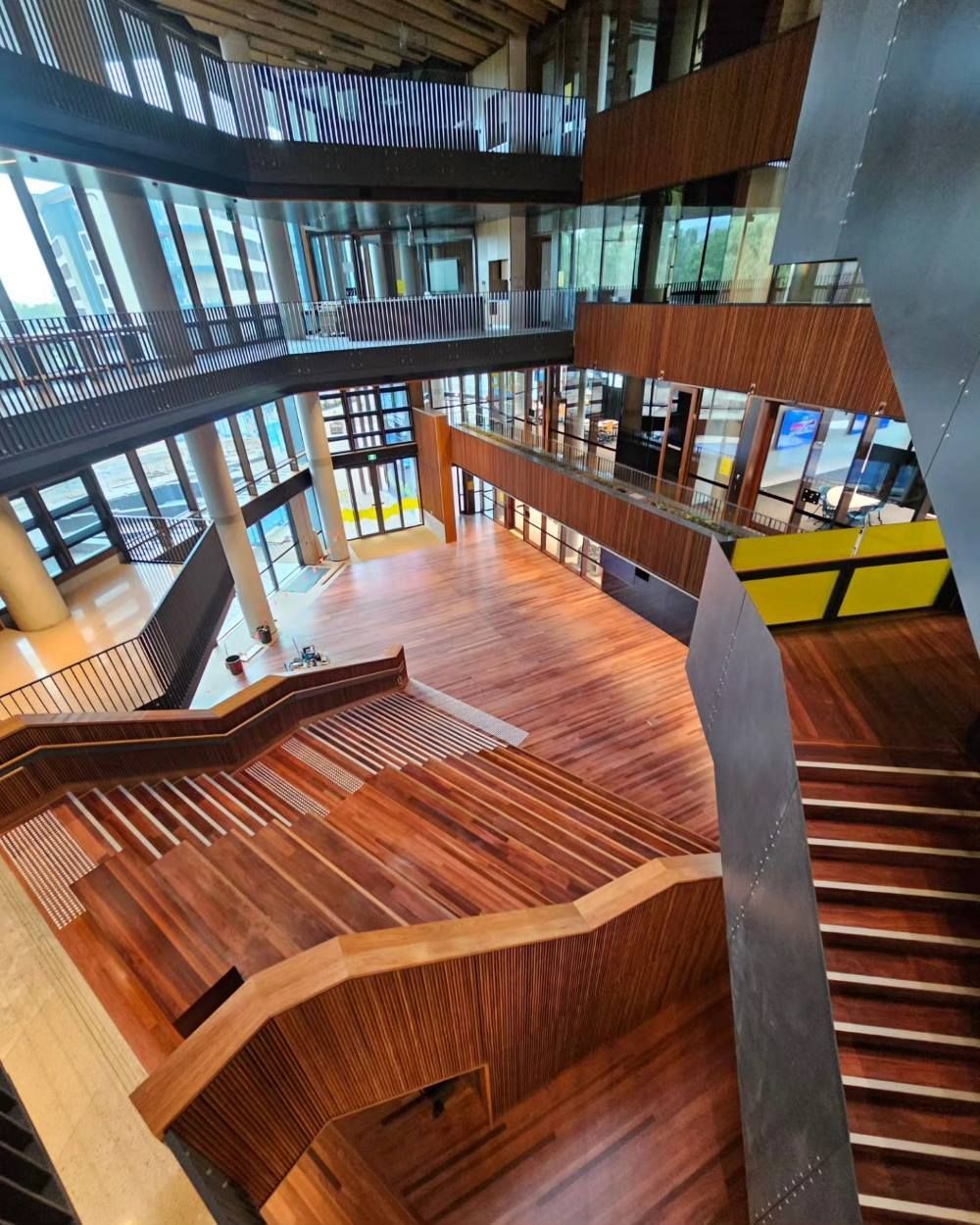 An Aerial View of a Building With Wooden Stairs — ATM Floors In Mount Louisa, QLD