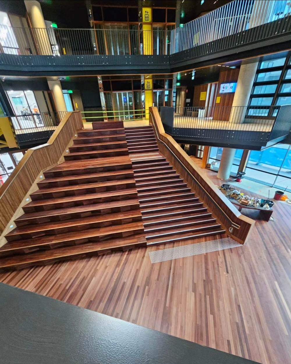 A Large Wooden Staircase in a Building With a Wooden Floor — ATM Floors In Mount Louisa, QLD