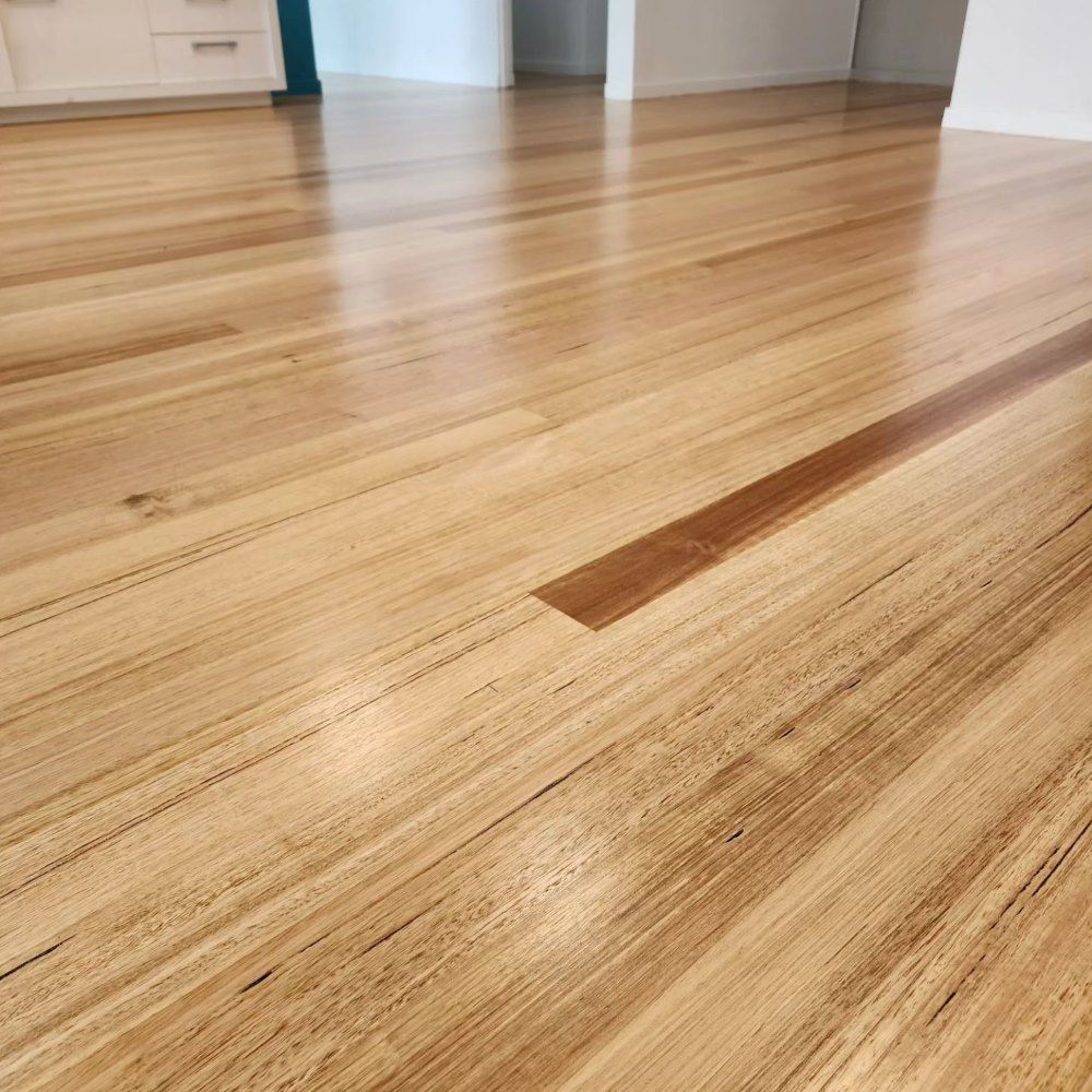A Close Up of a Wooden Floor in a Room — ATM Floors In Mount Louisa, QLD