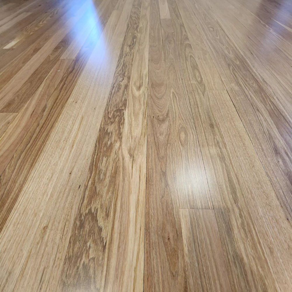 A Close Up of a Wooden Floor in a Room — ATM Floors In Mount Louisa, QLD