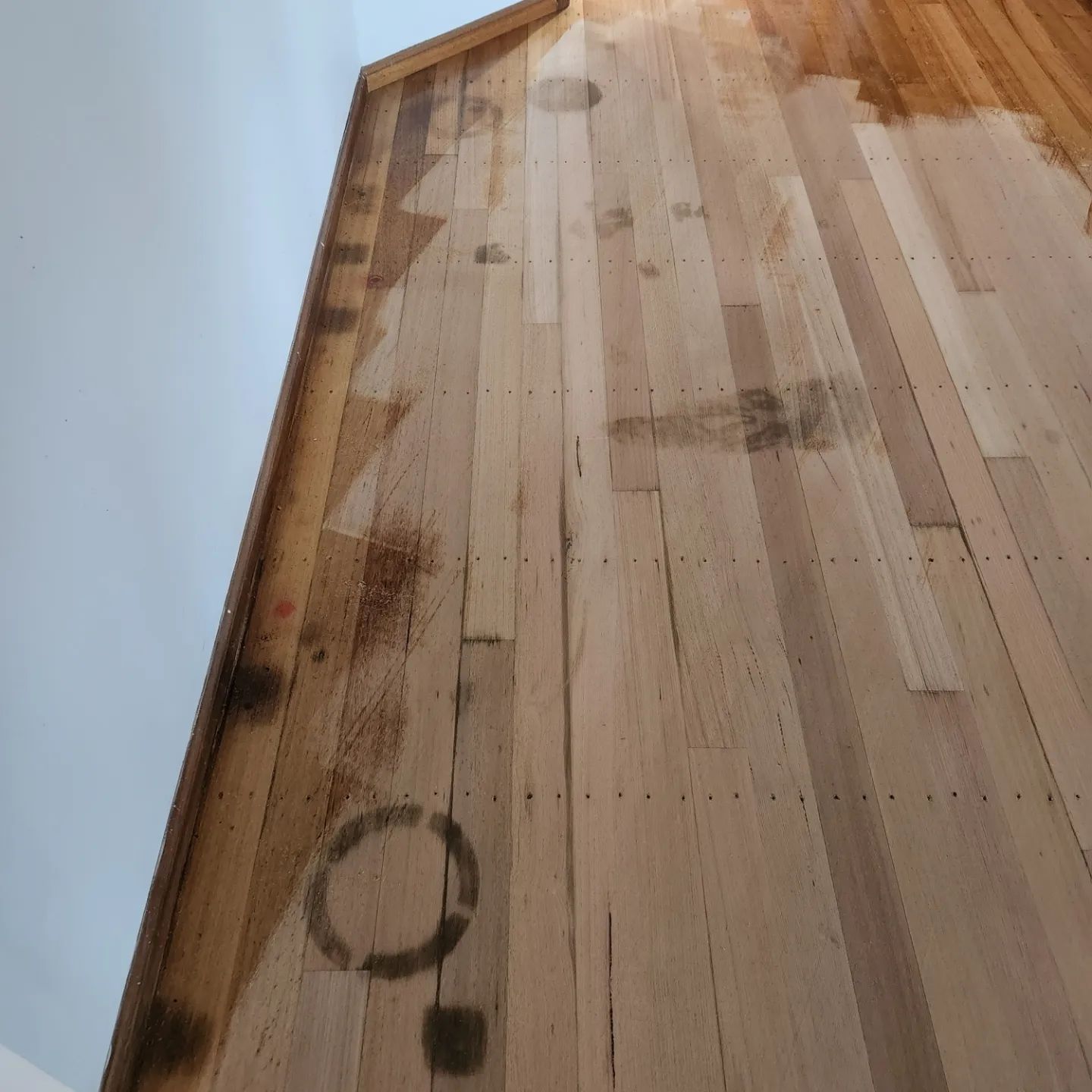 A Large Commercial Space With A Wooden Floor And A Concrete Column — ATM Floors In Townsville, QLD