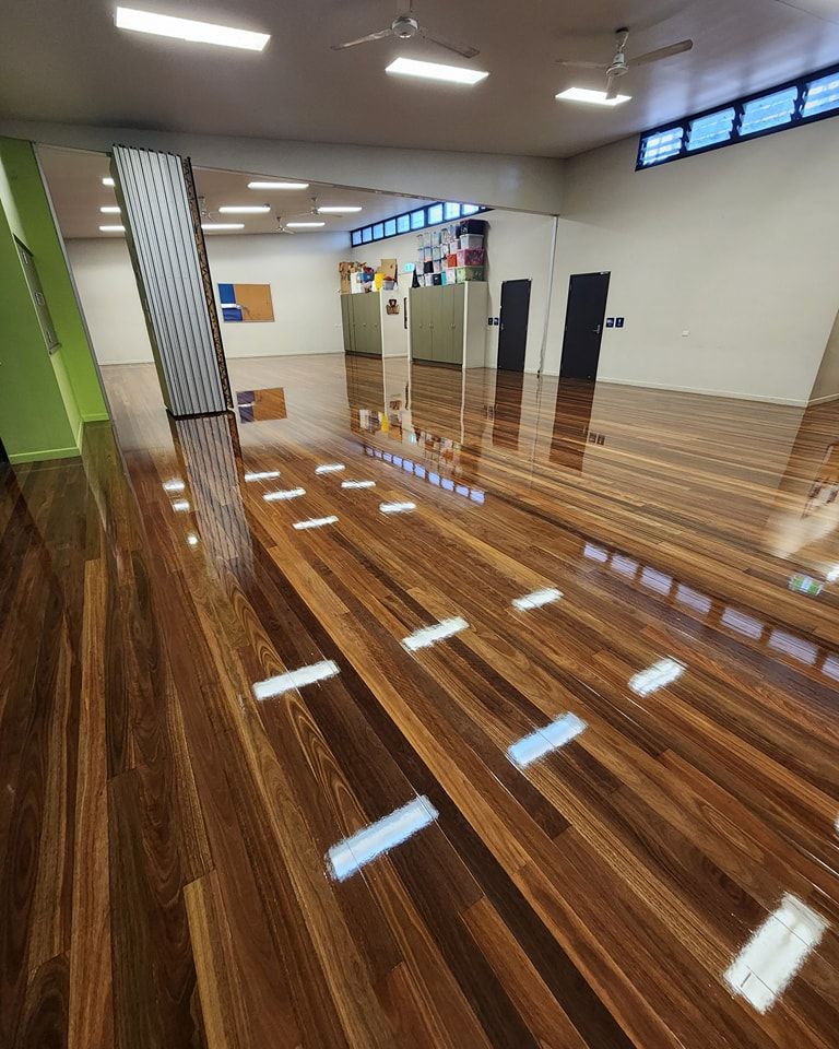 A Wooden Floor is Being Installed in a Room — ATM Floors In Mount Louisa, QLD