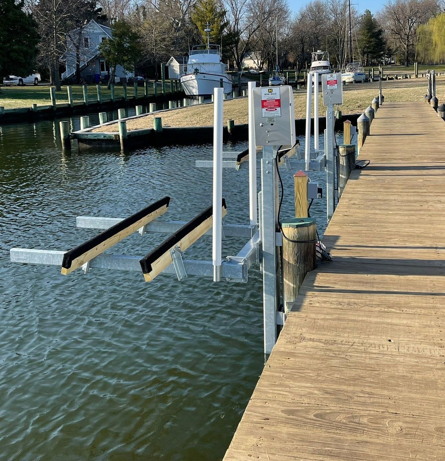 A dock with a boat lift attached to it
